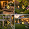 Decorative bee solar lights displayed in an outdoor garden