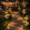 Sunflower garden stake lights illuminating an outdoor pathway