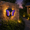 Solar-powered butterfly garden light with a warm evening glow