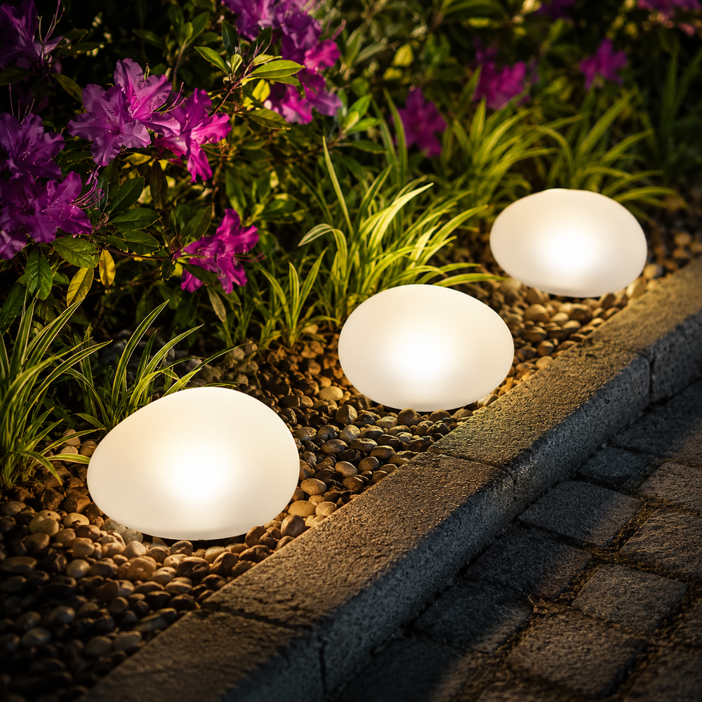 Solar powered stone pathway light in a garden setting
